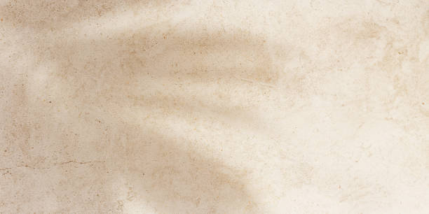 istock Summer banner, top view sun shadow from palm leaf on sandy colored background. Summer aesthetic photo pale beige colored, copy space, nobody, vacation and relaxation concept. Abstract view 2198098614