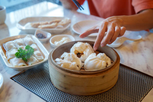 istock Freshly Steamed Char Siu Bao and Rice Rolls at a Dim Sum Restaurant 2198102233