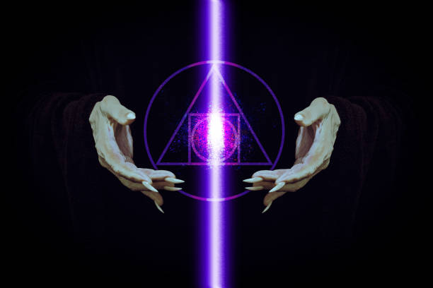 Energy glowing pillar and symbols of sacred geometry between magicians hands with sharp nails on black background, film grain. Witchcraft, demon, wizard, religion, creation act, alchemy concept.