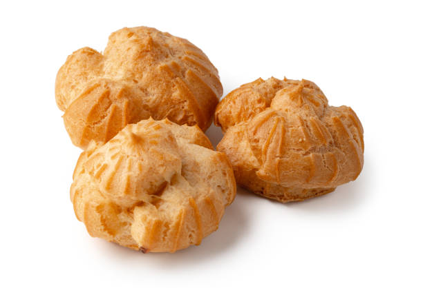 istock Freshly baked cream puffs displayed on a clean surface in bright indoor lighting 2198104150
