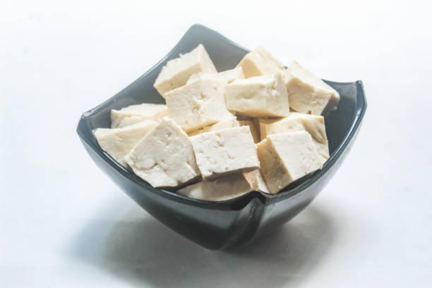 istock pieces of white tofu in a bowl on a white background 2198105285