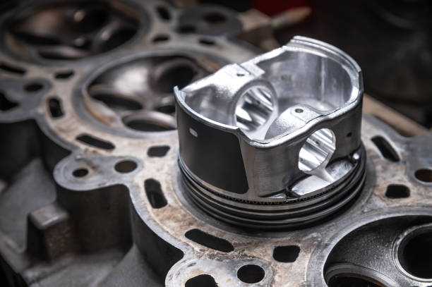 istock A new piston for the engine lies on a used engine block 2198106535