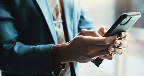 istock Businessman, cellphone and hands with typing for communication, connection or network in office. Male person, mobile technology and contact for online, email and internet as investment banker in firm 2198106695