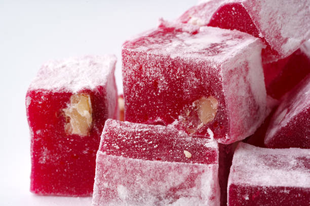istock Delightful Turkish delight pieces with pistachio nuts and powdered sugar on a white surface 2198107121