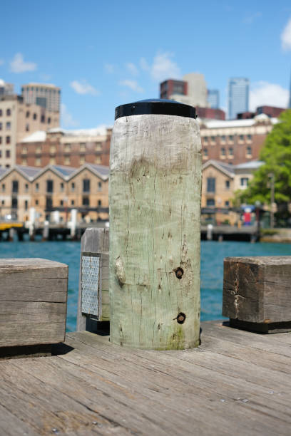 Old wooden mooring post on a wharf