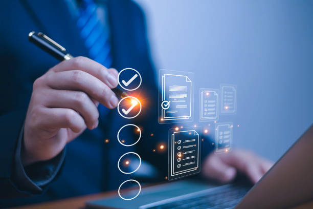 istock Business performance checklist concept, Businessman using laptop take an assessment,An businessman checklist online survey filling form list options business employee security procedures. 2198109956