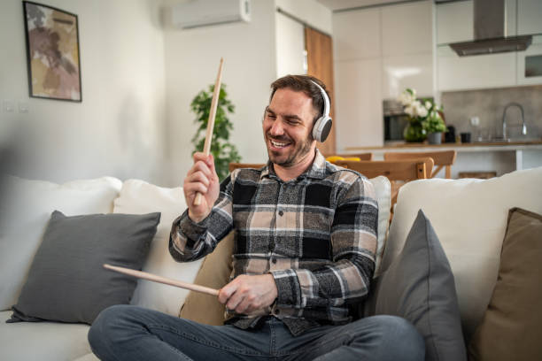 istock Man drumming in the air with passion and energy 2198110236