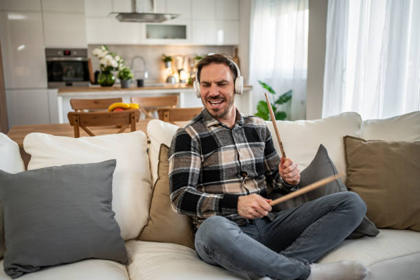 istock Man drumming in the air with passion and energy 2198110238
