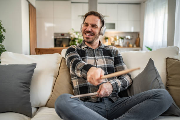 istock Man drumming in the air with passion and energy 2198110253