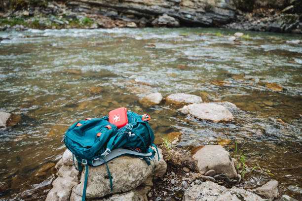 istock Experience an adventure with Riversides backpack and First Aid Kit in nature. Explore outdoors, enjoy serene landscapes, camping, hiking, and wildlife encounters 2198112327