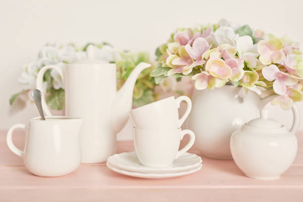 floral patterned glass cups and plates with white background