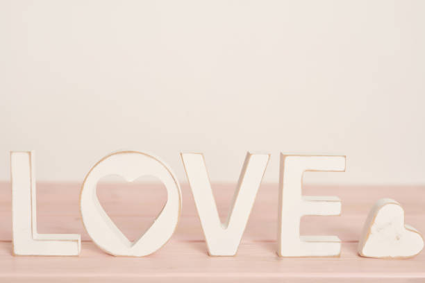 Set of white dishes on table on light background.