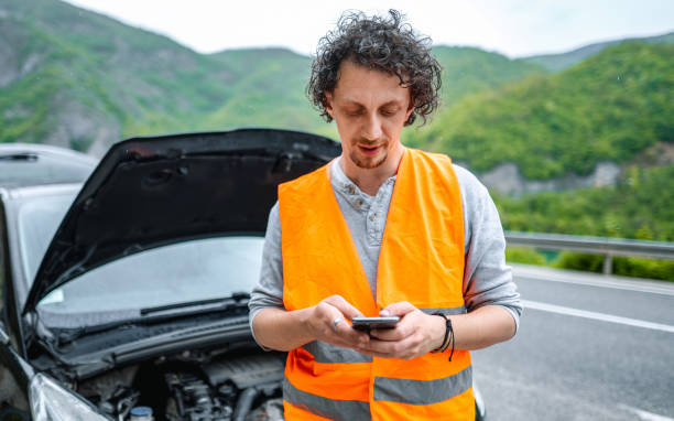 istock Young adult man handling car breakdown on roadside 2198114138