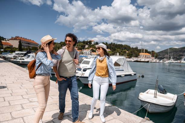 istock Friends enjoying a stroll by the harbor in dubrovnik 2198114260