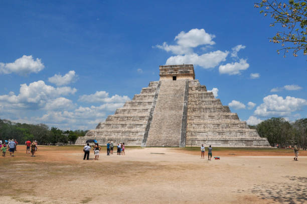 Chichen Itza, Mexico- May 17, 2013:  The ancient city of Chichen Itza is located in the state of Yucatan, eastern Mexico. it is one of the most important city-states in pre-Hispanic America and one of the New 7 Wonders of The World according to UNESCO. The main Mayan Ruin is the Chichen Itza Pyramid or El Castillo, but there are other equaly important as El Caracol or Observatory, The Temple of The Warriors and the Mayan Ball Game. Here is the gorgeous Pyramid or EI Castillo.