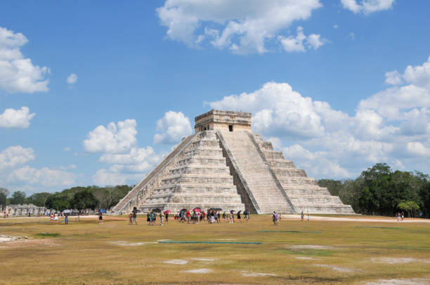 Chichen Itza, Mexico- May 17, 2013:  The ancient city of Chichen Itza is located in the state of Yucatan, eastern Mexico. it is one of the most important city-states in pre-Hispanic America and one of the New 7 Wonders of The World according to UNESCO. The main Mayan Ruin is the Chichen Itza Pyramid or El Castillo, but there are other equaly important as El Caracol or Observatory, The Temple of The Warriors and the Mayan Ball Game. Here is the gorgeous Pyramid or EI Castillo.
