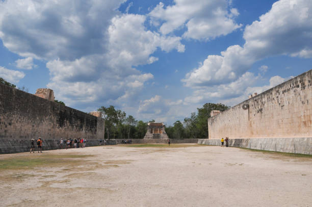 Chichen Itza, Mexico- May 17, 2013:  The ancient city of Chichen Itza is located in the state of Yucatan, eastern Mexico. it is one of the most important city-states in pre-Hispanic America and one of the New 7 Wonders of The World according to UNESCO. The main Mayan Ruin is the Chichen Itza Pyramid or El Castillo, but there are other equaly important as El Caracol or Observatory, The Temple of The Warriors and the Mayan Ball Game. Here is the  Gran Juego de Pelota (Grand Ball Court).