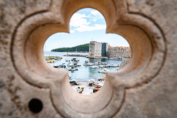 istock Scenic view of dubrovnik through stone archway 2198115005