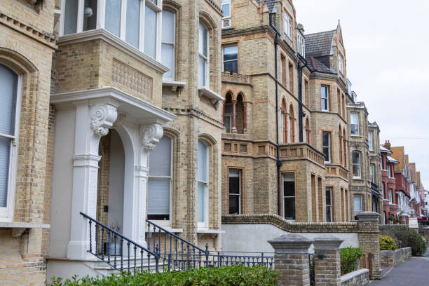 istock Row of brick apartment buildings 2198115434