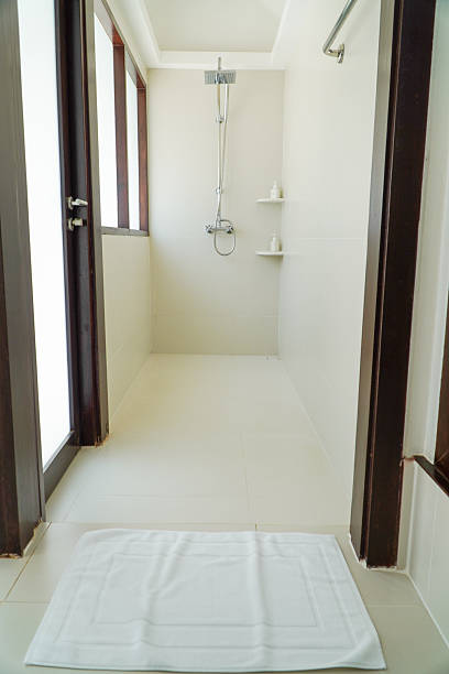 istock Shower in the bathroom. Bathroom interior with shower head. 2198115792