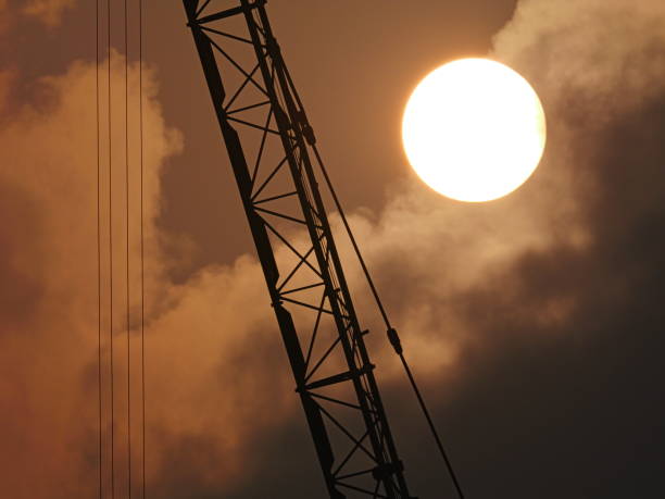 Sunrise morning​ cloud moving crane construction