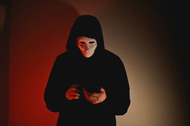 istock person in mask with smart phone 2198118518