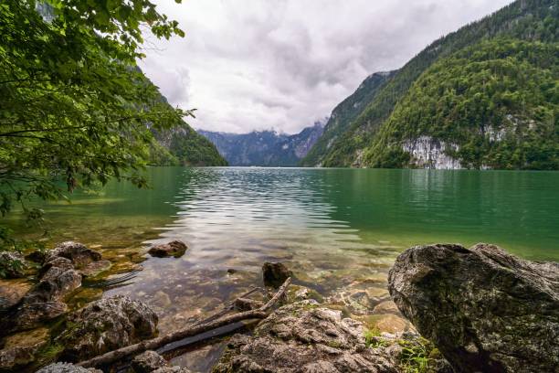 istock Tranquil Lake with Lush Green Mountains 2198118531