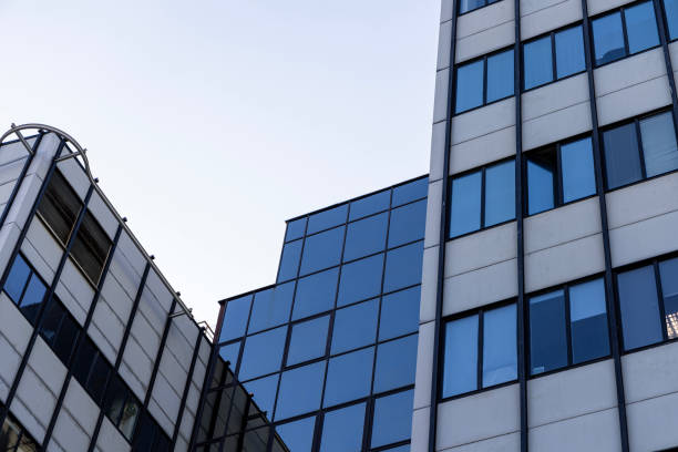 istock Modern building facade with large glass windows. Business office background 2198121140