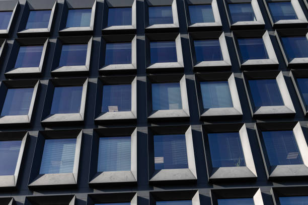 istock Modern building facade with large glass windows. Business office background 2198121444