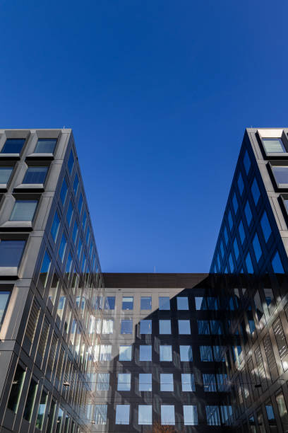 istock Modern building facade with large glass windows. Business office background 2198121451
