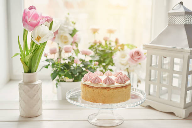 Easter composition with sweet bread, Easter cake, eggs, bouquet of flowers. Holidays breakfast concept with copy space. Traditional easter cake with gingerbread cookies. Easter Greeting Card Template.