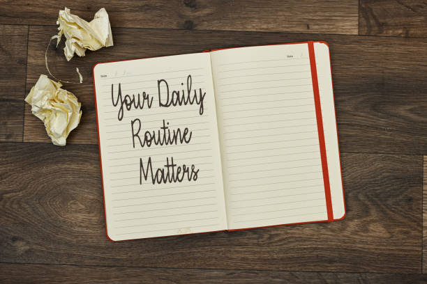 istock Your Daily Routine Matters concept for practice of regularly notebook with sheet paper on wood table 2198124066