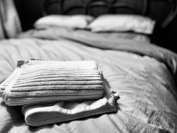 istock Folded towels on a bed in a domestic setting in our bedroom 2198124455