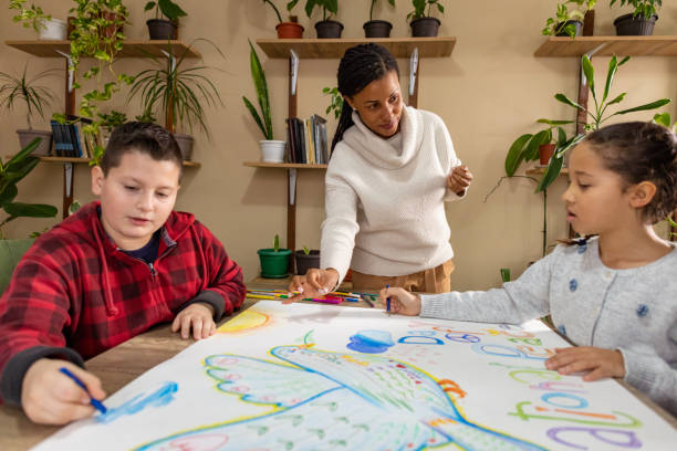 istock Teacher Encourages Peace Art 2198126333