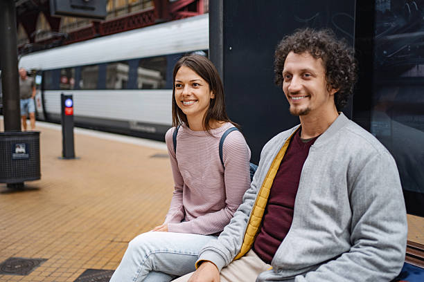 istock Smiling young adults waiting at copenhagen train station 2198128431