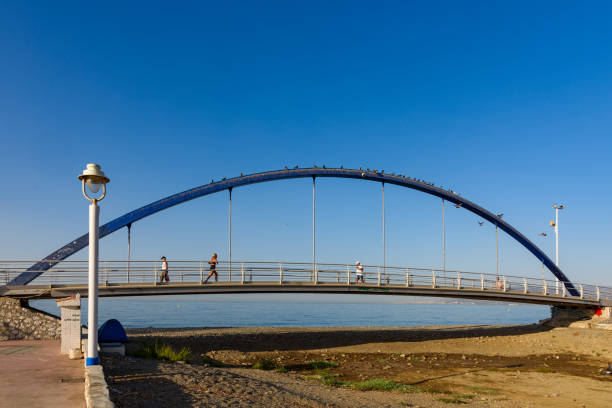Malaga, Spain - August 06, 2024: PASARELA PEATONAL Small bridge on the beach in Spain