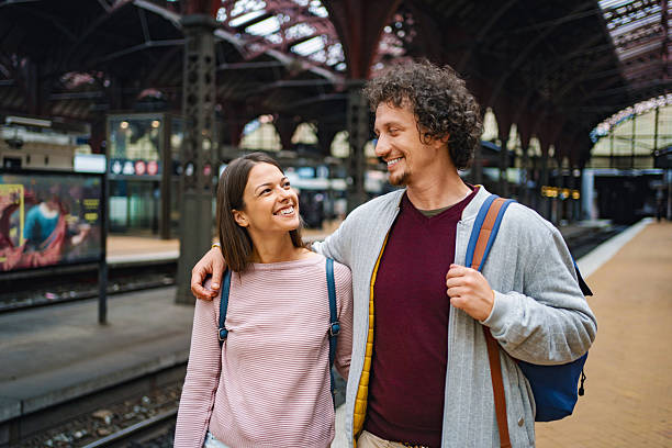 istock Smiling couple enjoying copenhagen train station 2198128651