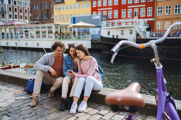 istock Friends enjoying waterfront view in copenhagen 2198129221