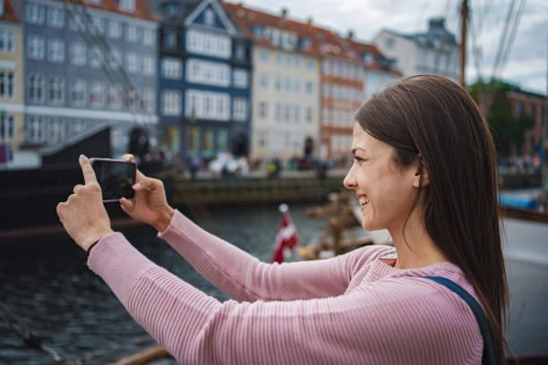istock Young woman taking selfie in copenhagen 2198129259