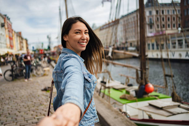 istock Young woman exploring scenic copenhagen harbor 2198129322
