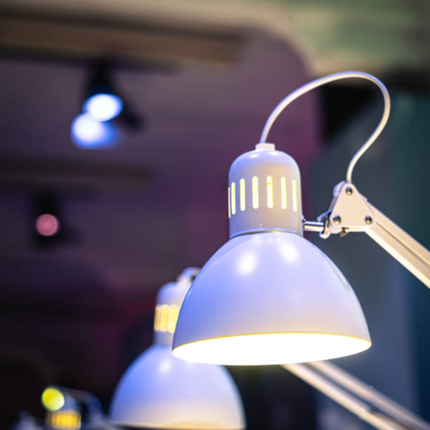 Electric lights in a row on a desktop room interior scene