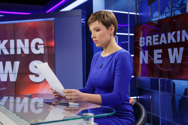 istock Breaking news female anchor 2198130247