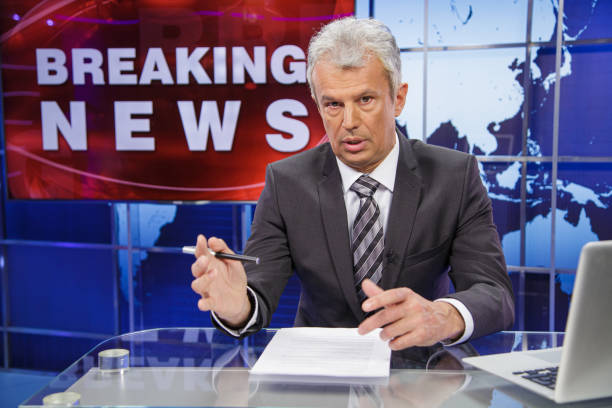istock Breaking news senior male anchor 2198130290
