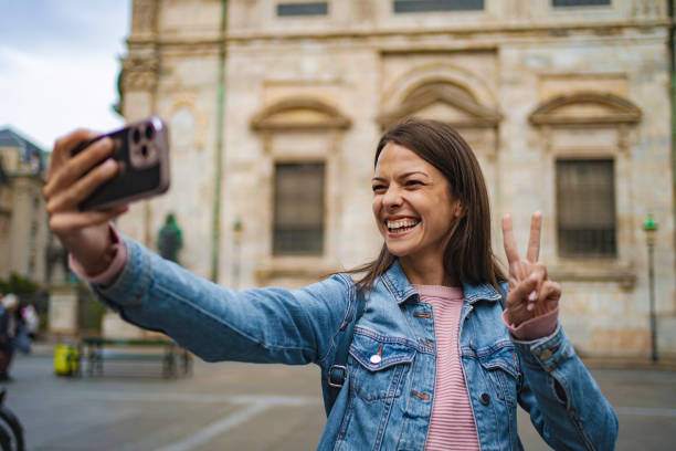 istock Young woman taking selfie in copenhagen 2198130398