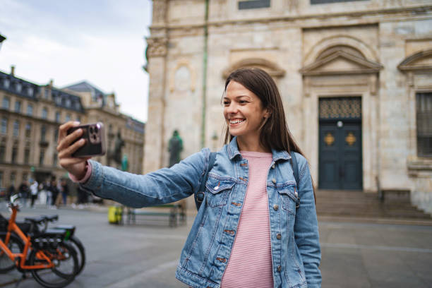istock Young woman taking a selfie in copenhagen 2198130401