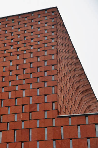 istock Red brick facade with narrow windows of a modern building, modern architecture Poland 2198130664