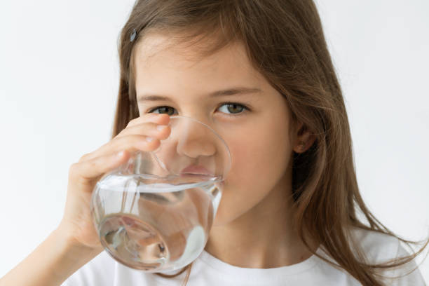 istock Young Girl Drinking Water from a Glass 2198130832