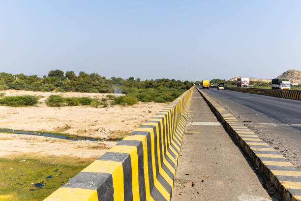 istock national highway tarmac road view at bright day light from different angle 2198130890