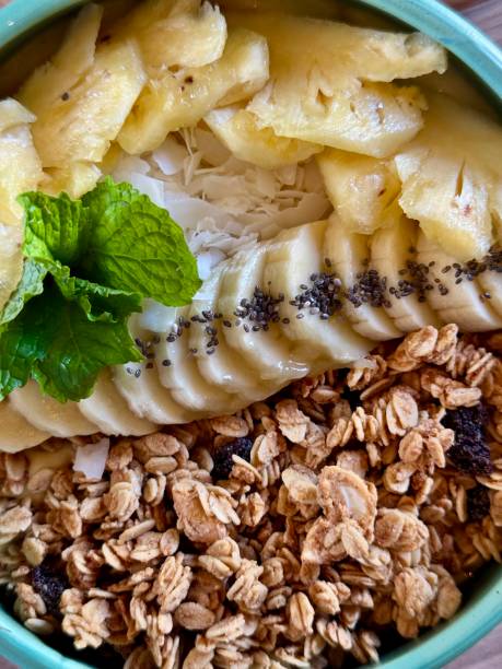 istock Smoothie bowl with bananas, berries, granola and other ingredients 2198131387