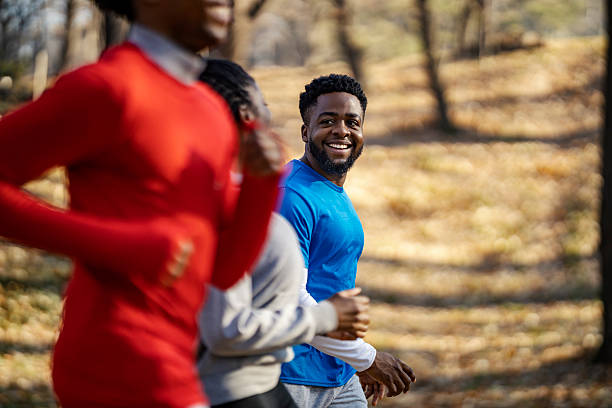 istock Smiling fit multicultural sportspeople running and practicing in nature. 2198134550